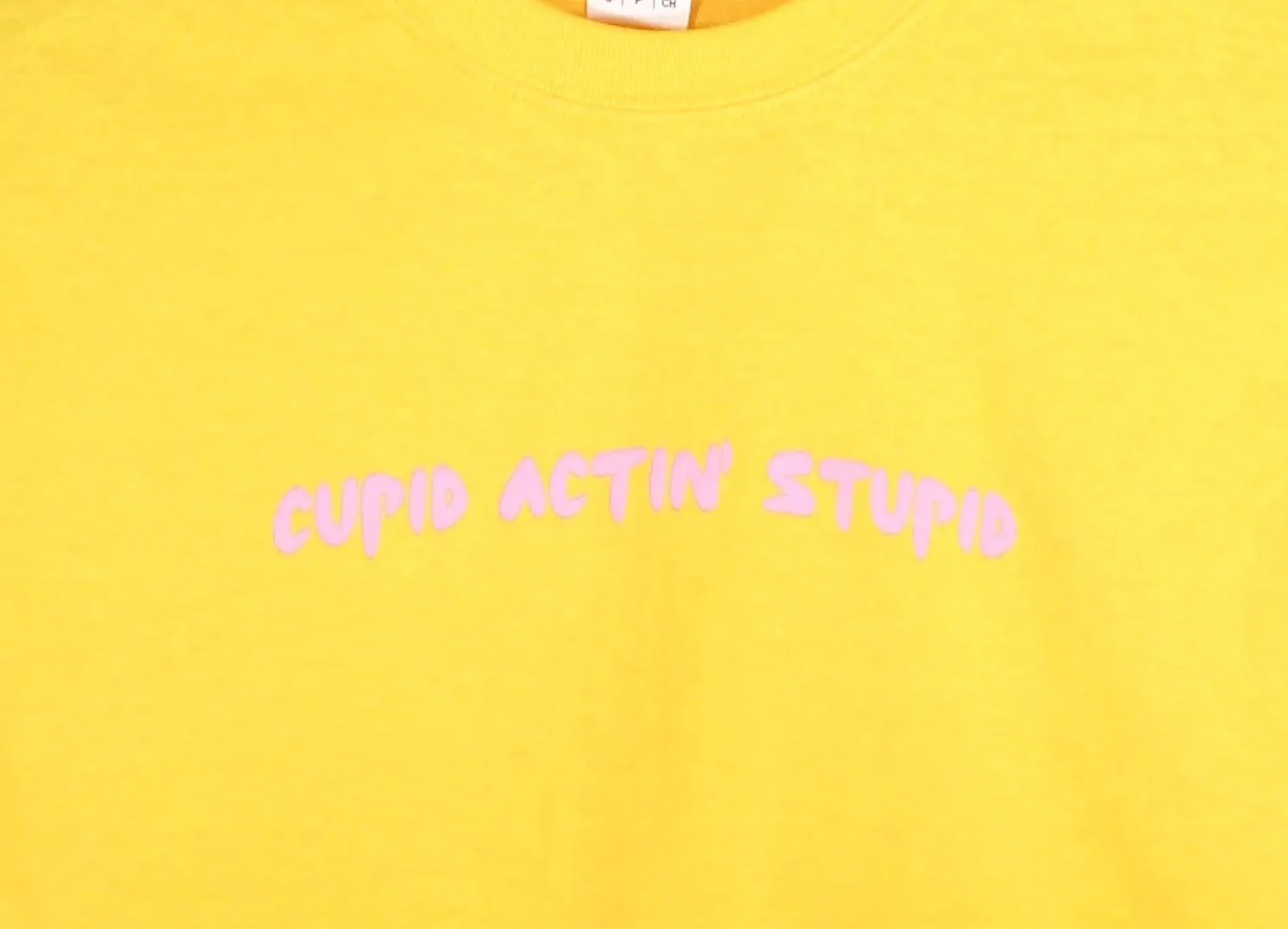 Cupid Actin' Stupid Yellow Graphic Unisex Tee